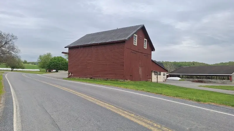 Barn and grazing land at the Fisher family farm